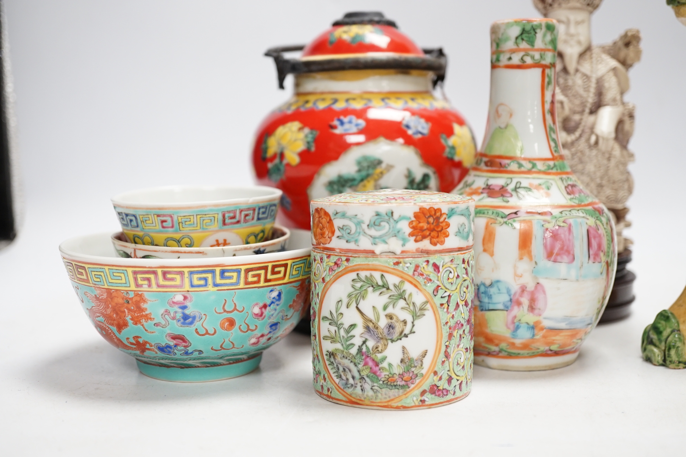 A group of Chinese ceramics 18th century and later, including a bottle vase, a water pipe vessel, box and cover, three bowls, a Tang style figure of a lady, a Yixing teapot, together with a resin figure of an emperor